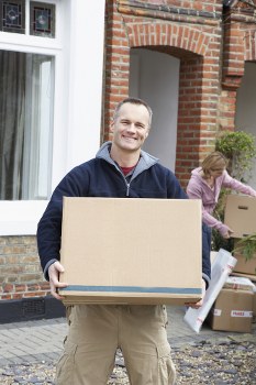 Professional moving team preparing boxes