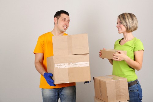 Professional movers loading furniture into a van